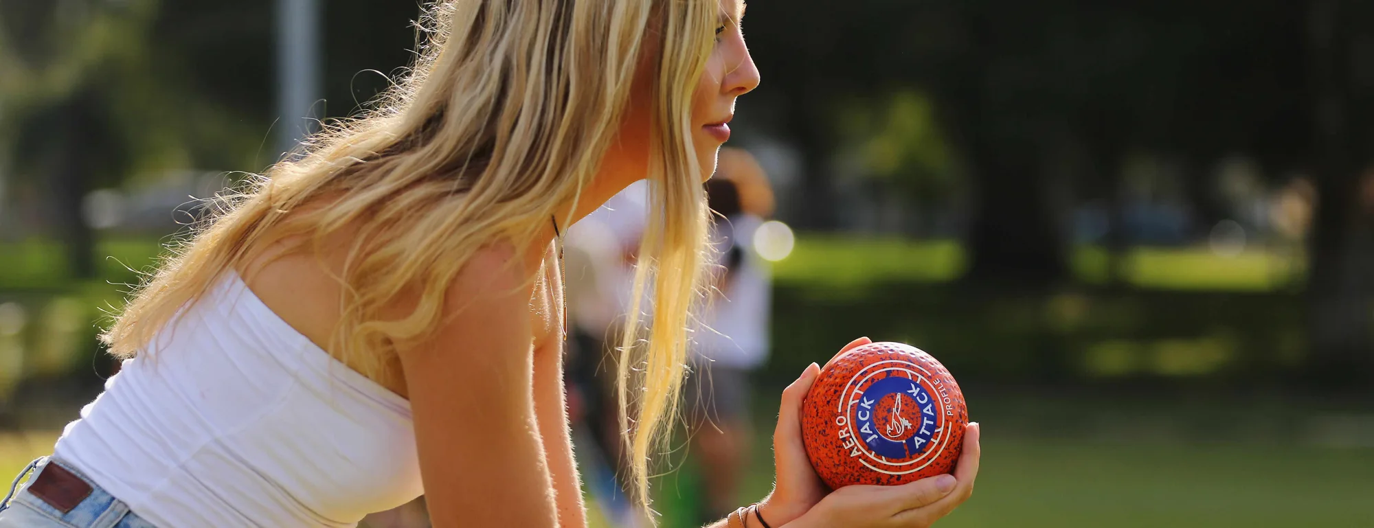 A bowler lines up a delivery on the grass