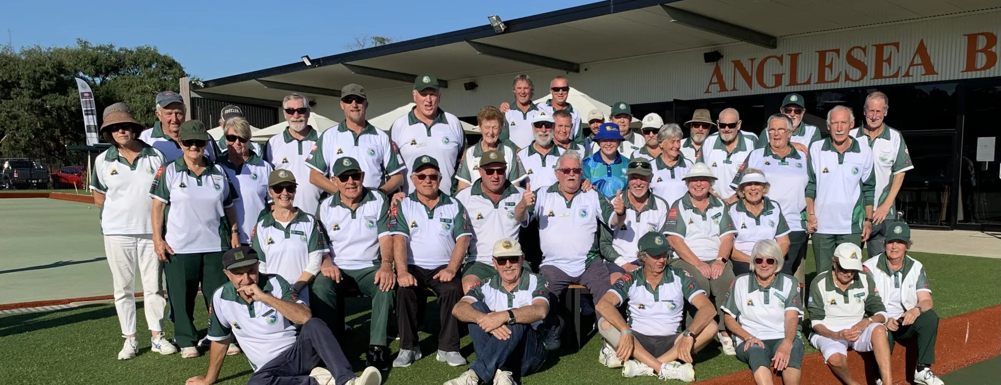 Anglesea Bowling Club members lined up on the green in club colours