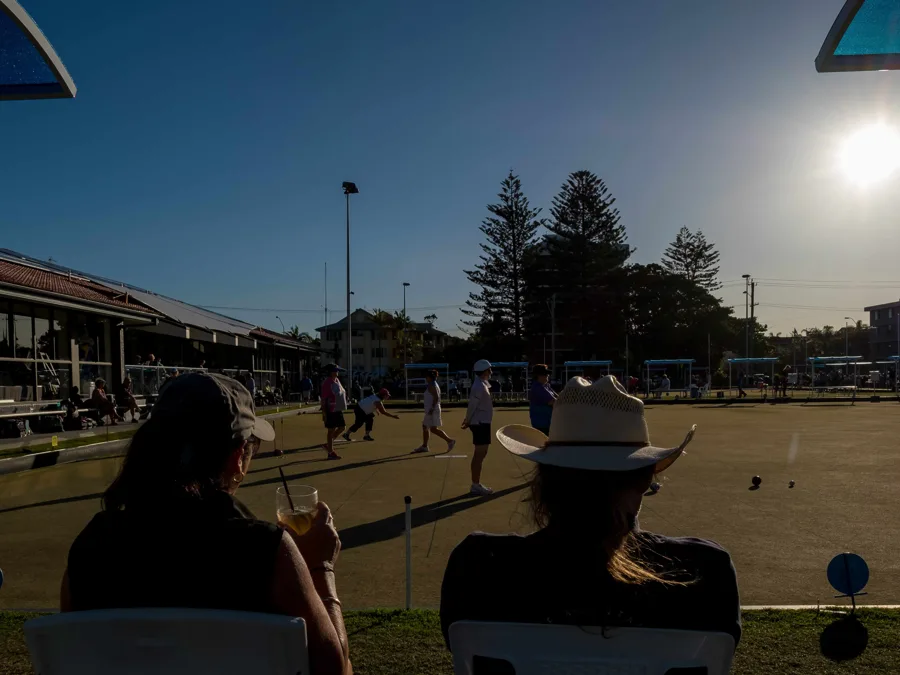 Sunset over the green with spectators