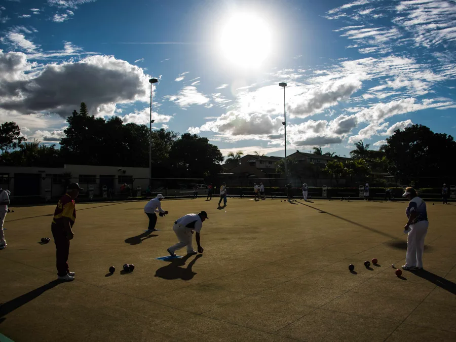 Bowls under lights at twilight on the Anglesea green